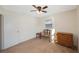 Bedroom with ceiling fan, dresser, and bench at 8254 40Th N Ave, St Petersburg, FL 33709