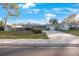 Single-story home with a driveway and well-maintained lawn at 8254 40Th N Ave, St Petersburg, FL 33709
