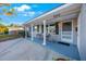 Front view of a house with a porch and landscaping at 8254 40Th N Ave, St Petersburg, FL 33709