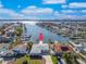 Aerial view of waterfront home with private dock and boat access at 855 115Th Ave, Treasure Island, FL 33706