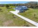 A long driveway and big yard accent this beautiful modern home at 937 Old Welcome Rd, Lithia, FL 33547