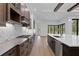 Modern kitchen featuring stainless steel appliances and a central island with pendant lighting at 937 Old Welcome Rd, Lithia, FL 33547