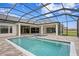 Screened-in pool and jacuzzi with beautiful travertine deck and outdoor living space at 937 Old Welcome Rd, Lithia, FL 33547