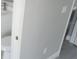 Contemporary bathroom toilet adjacent to the doorway entrance at 103 2Nd Ne Ave, Lutz, FL 33549