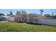 Well-manicured lawn and landscape create an inviting curb appeal for this single-story home at 103 2Nd Ne Ave, Lutz, FL 33549