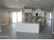 Modern kitchen with stainless steel appliances, sleek cabinetry, and an island at 103 2Nd Ne Ave, Lutz, FL 33549