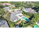 Aerial view showing house, pool, and surrounding neighborhood at 105 Estado Ne Way, St Petersburg, FL 33704