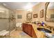Elegant bathroom featuring a large walk-in shower, granite countertops, and dark wood cabinets at 105 Estado Ne Way, St Petersburg, FL 33704