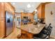 Well-equipped kitchen with granite countertops and wood cabinets at 105 Estado Ne Way, St Petersburg, FL 33704