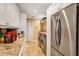 Bright laundry room with modern appliances, granite countertops, and ample storage at 105 Estado Ne Way, St Petersburg, FL 33704