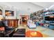 Spacious living room with built-in shelving and hardwood floors at 105 Estado Ne Way, St Petersburg, FL 33704