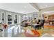Spacious living room with hardwood floors, large windows, and comfortable seating at 105 Estado Ne Way, St Petersburg, FL 33704