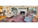 Elegant living room featuring a fireplace and hardwood floors at 105 Estado Ne Way, St Petersburg, FL 33704