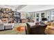 Sunlit living room with a unique terrazzo floor and built-in shelving at 105 Estado Ne Way, St Petersburg, FL 33704