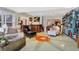 Spacious living room with hardwood floors, large windows, and comfortable seating at 105 Estado Ne Way, St Petersburg, FL 33704