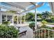 Inviting pool area with a pergola, lounge chairs, and lush landscaping at 105 Estado Ne Way, St Petersburg, FL 33704