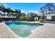 Relaxing kidney-shaped pool with brick pavers at 105 Estado Ne Way, St Petersburg, FL 33704