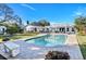 Stunning pool and patio area with a beautiful house in the background at 105 Estado Ne Way, St Petersburg, FL 33704