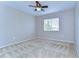 Well-lit bedroom with ceiling fan and neutral carpeting at 10816 Lakeside Vista Dr, Riverview, FL 33569