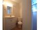 Clean bathroom with toilet, sink, and shower at 1708 Preston S St, St Petersburg, FL 33712