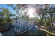 House exterior with a white ramp and mature trees in the front at 1708 Preston S St, St Petersburg, FL 33712