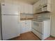 Clean white kitchen with microwave and stovetop at 1708 Preston S St, St Petersburg, FL 33712