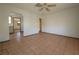 Living room with tile floor and view into kitchen area at 1708 Preston S St, St Petersburg, FL 33712