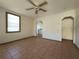 Living room with tile floors, ceiling fan, and view of kitchen at 1708 Preston S St, St Petersburg, FL 33712