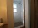 Simple shower with tiled walls and a window at 1708 Preston S St, St Petersburg, FL 33712