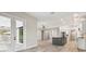 Open living area with French doors leading to a patio at 19504 Sheltered Hill Dr, Brooksville, FL 34601