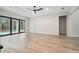 Bright Gathering room featuring hardwood floors and sliding glass doors leading to a pool at 19504 Sheltered Hill Dr, Brooksville, FL 34601