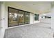 Spacious paved patio with sliding glass doors, ideal for outdoor entertaining at 19504 Sheltered Hill Dr, Brooksville, FL 34601