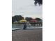 Community pool with accessible lift, umbrellas, and lounge chairs at 2359 Finlandia Ln # 27, Clearwater, FL 33763