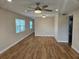 Bright living room featuring hardwood floors and a ceiling fan at 2359 Finlandia Ln # 27, Clearwater, FL 33763