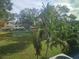 Community backyard with lush landscaping and green space at 2359 Finlandia Ln # 27, Clearwater, FL 33763