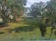 Community backyard with lush landscaping and green space at 2359 Finlandia Ln # 27, Clearwater, FL 33763