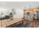 Open-concept dining area with hardwood floors, connecting to kitchen with island seating at 2503 E 19Th Ave, Tampa, FL 33605