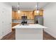 Modern kitchen island features a white countertop, pendant lighting, and stainless steel appliances for a sleek look at 2503 E 19Th Ave, Tampa, FL 33605