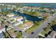 Aerial view of a house located on a canal, with a camper, and surrounded by other houses at 3306 Holly Springs Dr, Hernando Beach, FL 34607