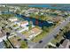 Aerial view of a house located on a canal, with a camper, and surrounded by other houses at 3306 Holly Springs Dr, Hernando Beach, FL 34607