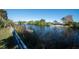 Peaceful view of canal with lush vegetation and private dock at 3306 Holly Springs Dr, Hernando Beach, FL 34607