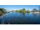 Scenic view of canal with boats and lush greenery at 3306 Holly Springs Dr, Hernando Beach, FL 34607