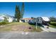Single story home with a grassy yard and RV parking at 3306 Holly Springs Dr, Hernando Beach, FL 34607