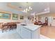 Kitchen with island, granite countertops, and wood cabinets at 397 Doniphan Dr, Port Charlotte, FL 33954