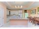 Modern kitchen with white cabinets and granite island at 397 Doniphan Dr, Port Charlotte, FL 33954