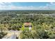 Aerial view of a house on a tree-lined street at 397 Doniphan Dr, Port Charlotte, FL 33954