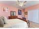 Bedroom with a queen-size bed, wood floors, and ceiling fan at 397 Doniphan Dr, Port Charlotte, FL 33954