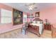 Main bedroom with large antique bed, wood floors and decorative artwork at 397 Doniphan Dr, Port Charlotte, FL 33954