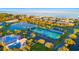 Aerial view of community with tennis court, pool, and pond at 4832 Cobia Se Dr # B, St Petersburg, FL 33705