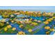 Aerial view of community with tennis courts and pool at 4832 Cobia Se Dr # B, St Petersburg, FL 33705
